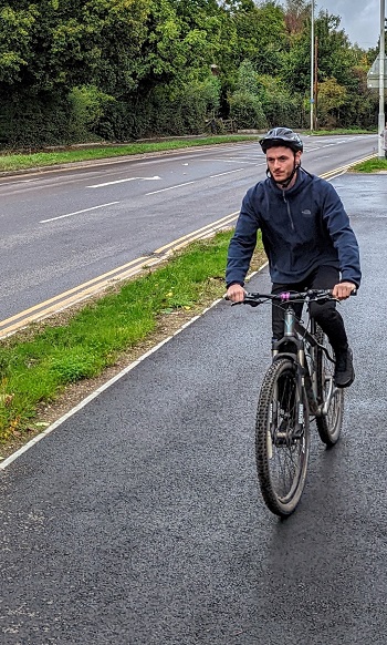 Person cycling on new cycle path