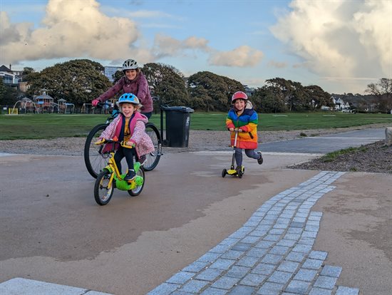 Family cycling and scooting