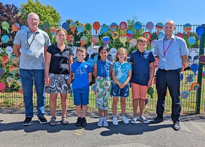 Adults and children having a photo taken