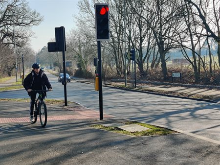 person riding bike on Queen Anne Drive