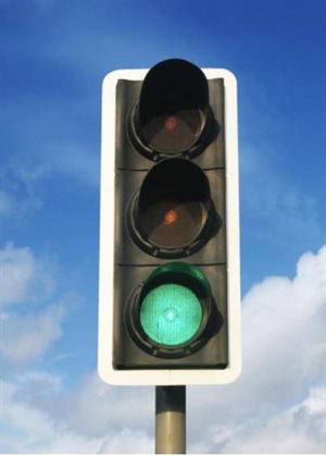 A traffic light, with a green light showing